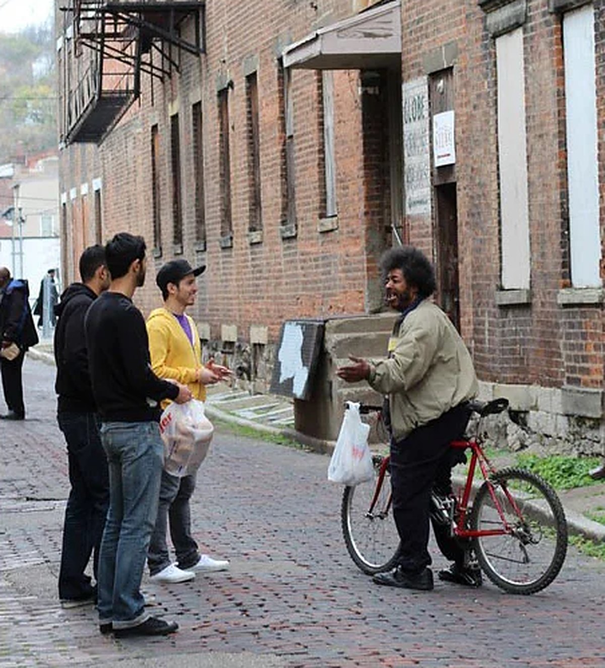 Project Downtown volunteers talking with a neighbor on a downtown Cincinnati street